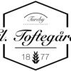 Gårdejer Vivi-Ann Sauer Lange. logo